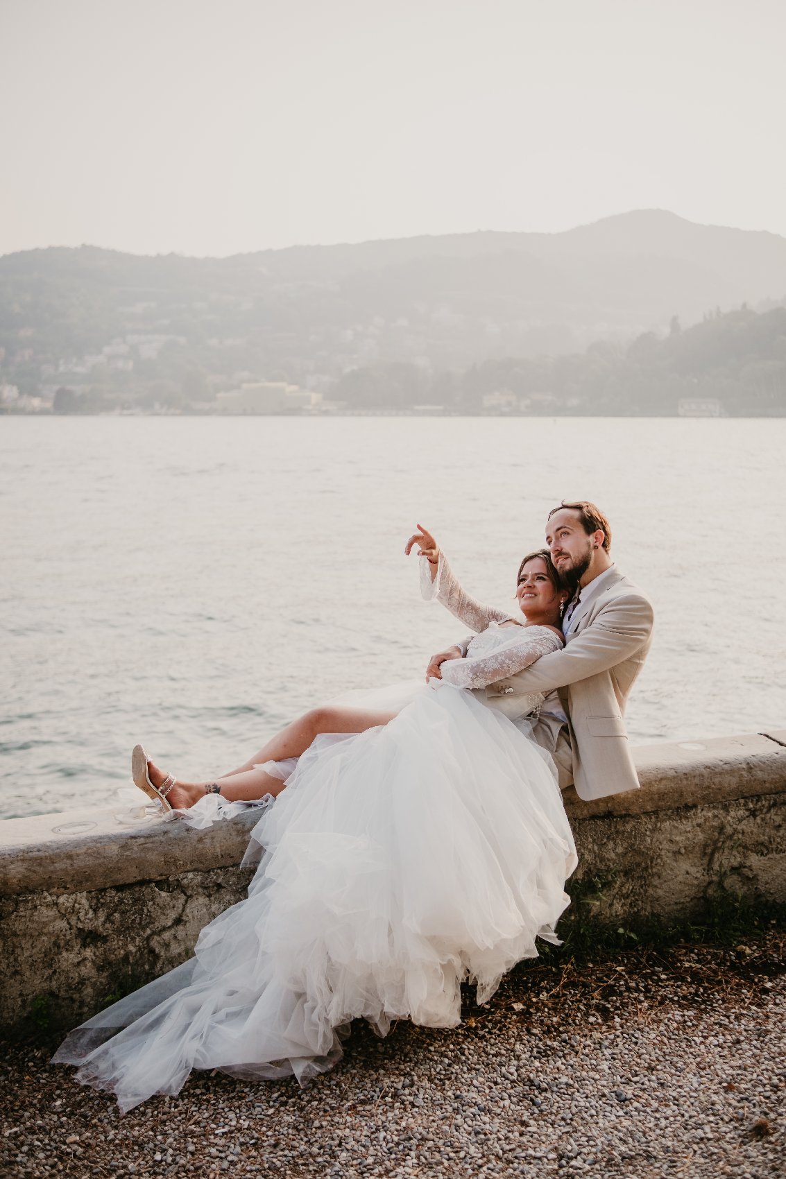 Bride and groom walking by Lake Como in Italy – captured by Prague destination wedding photographer